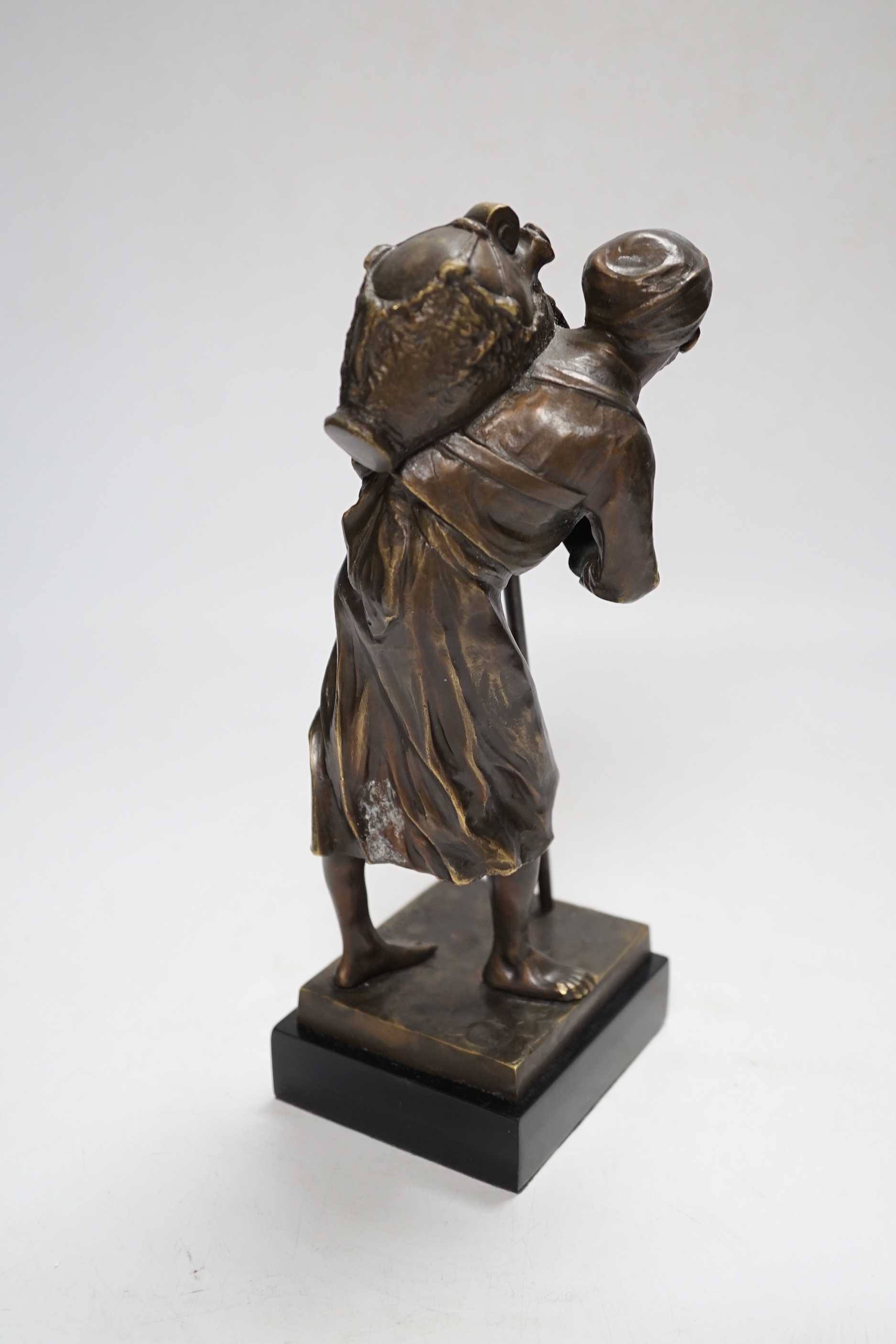 After Paul Ludwig Kowalczewski, a bronze of an African wine seller, 24cm